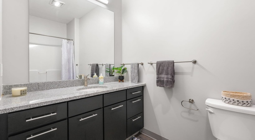 Bathroom bathroom with a large mirror and ample lighting